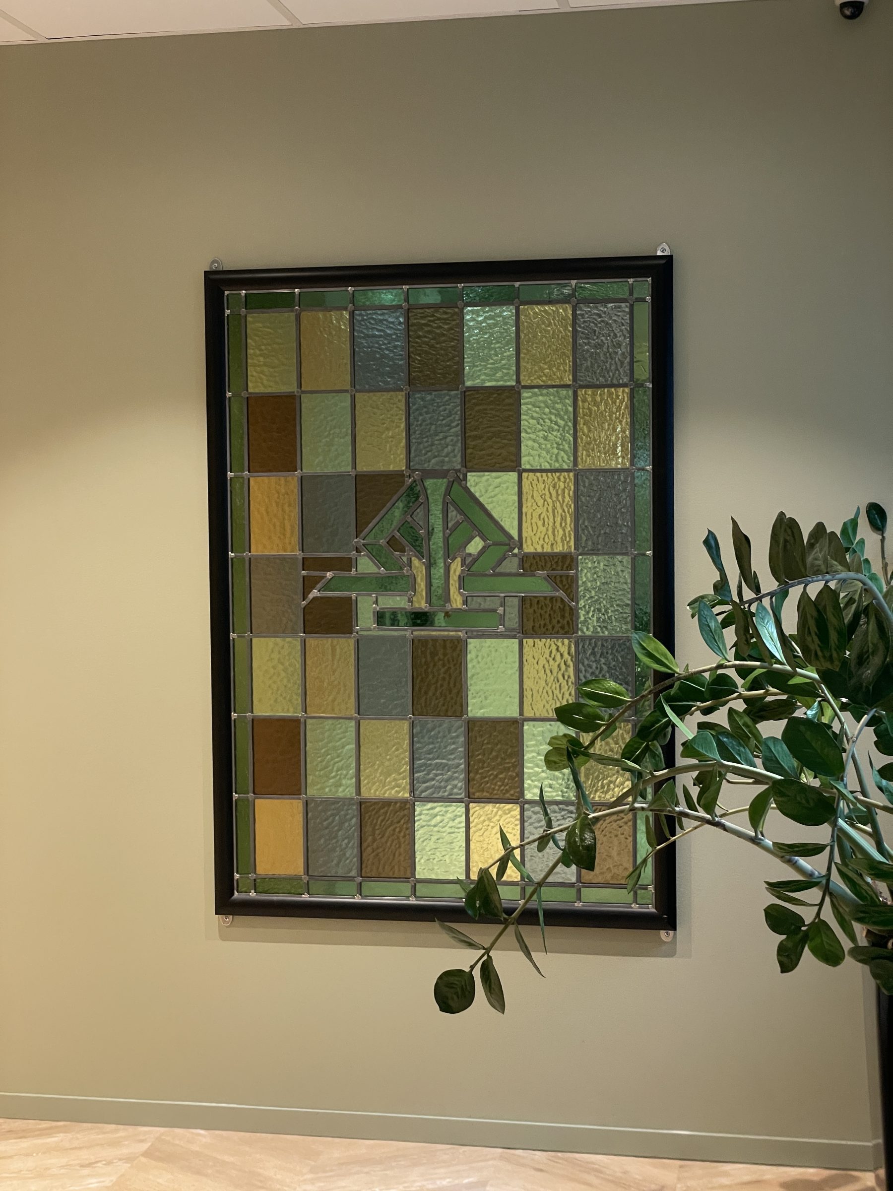Fargetrukturert glasskunst med grønne nyanser